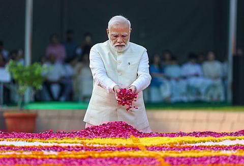 Prime Minister Narendra Modi pays homage to Mahatma Gandhi on the occasion of his birth anniversary, at Rajghat in New Delhi, Monday, Oct. 2, 2023. (Photo | PTI)