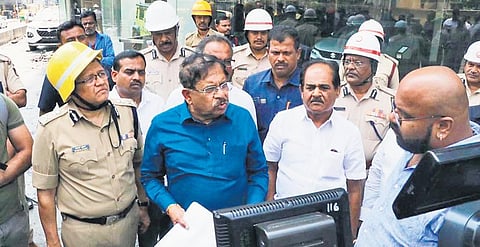 Home Minister Dr G Parameshwara and DGP Kamal Pant on Thursday inspect the cafe where a fire broke out on Wednesday | Express