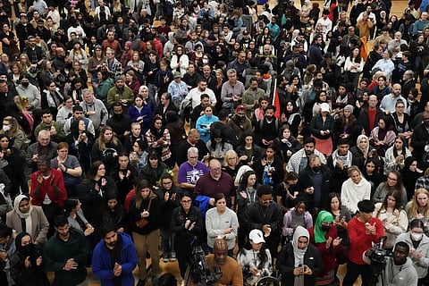 Mourners hold candles for 6-year-old Palestinian American boy, Wadea Al Fayoume, during a vigil at Prairie Activity and Recreation center in Plainfield. (Photo | AP)
