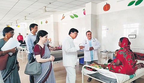 Health Minister Niranjan Pujari interacting with a patient in Malkangiri | Express