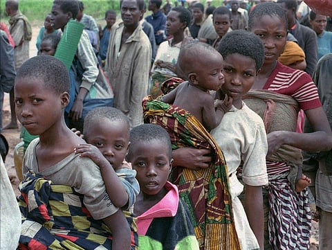 FILE - Hutu refugees wait to be registered at Kigali airport Rwanda, May 4, 1997. (Photo | AP)