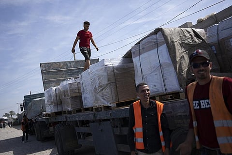 Trucks with humanitarian aid for the 'Gaza Strip enter from Egypt in Rafah on Saturday, Oct. 21, 2023. (Photo | AP)