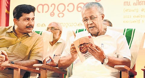 CM Pinarayi Vijayan goes through Oru Samara Noottandu, the book on CPM veteran V S Achuthanandan written by K V Sudhakaran, in Thiruvananthapuram | Vincent Pulickal