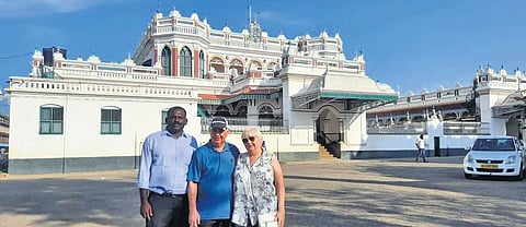 Manikandan with foreign tourists at the Chettinad Palace, Sivaganga | Express