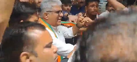 BJP's MP polls in-charge and union minister Bhupendra Yadav being heckled by angry party workers at BJP's Jabalpur office. (Videograb)