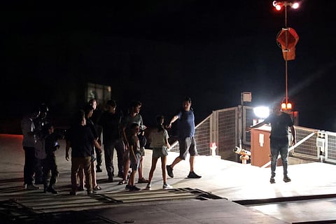 Relatives of Israeli hostages Nurit Cooper and Yocheved Lifshitz leave after welcoming them at Tel Aviv. (Photo | AP)