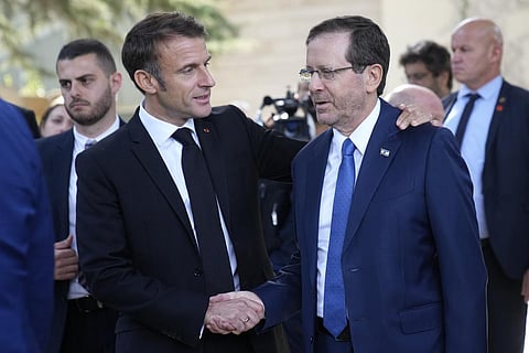 French President Emmanuel Macron with his Israeli counterpart Isaac Herzog. (Photo | AP)