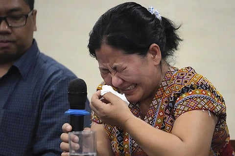 Burmese Zing Raltu breaks into tears as she talks to reporters after filing a criminal complaint against Myanmar's top generals at the Department of Justice in Manila, Oct 25, 2023. (Photo | AP)