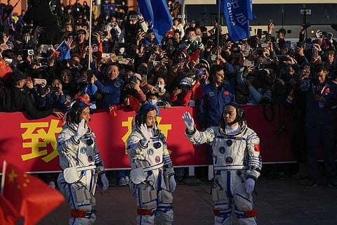 Chinese astronauts for the  Shenzhou-17 mission wave during a send-off ceremony at Jiuquan Satellite Launch Center, Thursday, Oct 26, 2023. (Photo | AP)