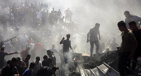 Palestinians inspect the rubble of destroyed buildings following Israeli airstrikes on the town of Khan Younis, southern Gaza Strip. (Photo | AP)