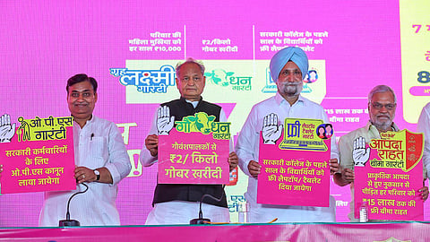 Rajasthan CM Ashok Gehlot with AICC in-charge Sukhjinder Singh Randhawa and others launch the party's 7 guarantees ahead of the state assembly elections, in Jaipur, Oct. 27, 2023. (Photo | PTI)