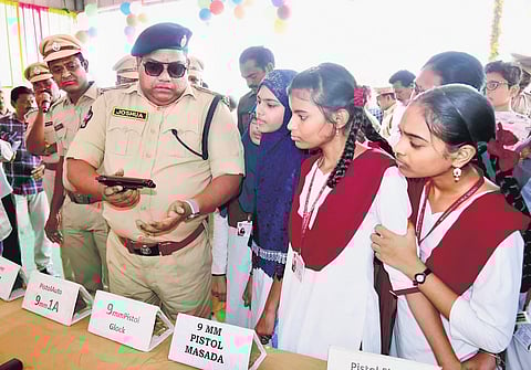 Krishna district Superintendent of Police Palle Joshua explaining about the arms and ammunition used by police force, at Open House programme I EXPRESS