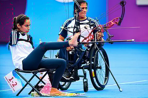 India's Sheetal Devi (L) during the archery event at the 4th Asian Para Games, in Hangzhou, China. Devi has won two gold medals and a silver medal in the tournament so far. (Photo | PTI)