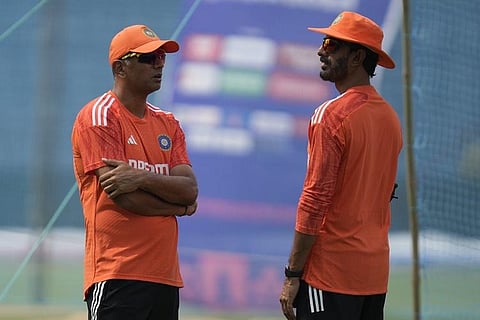 Indian batting coach Vikram Rathour, right, listen to head coach Rahul Dravid during a training session ahead of the ICC cricket world cup match against Bangladesh. (Photo | AP)