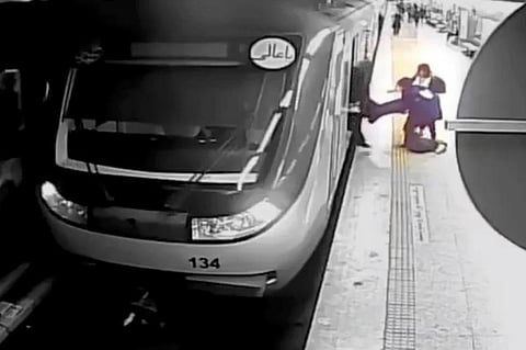 In this image from surveillance video aired by Iranian state television, women pull 16-year-old Armita Geravand from a train car on the Tehran Metro, Oct 1, 2023. (Photo | AP)