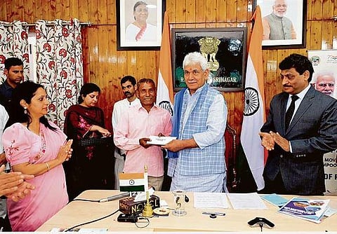 Land allotment letters handed over to J & K beneficiaries under housing scheme