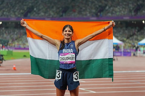 India's Parul Chaudhary celebrates after winning the gold medal in the final of women's 5000m athletics event at the 19th Asian Games. (Photo | PTI)