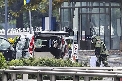 A bomb disposal expert works next to a car after an explosion in Ankara, Sunday, Oct. 1, 2023. (Photo | AP)