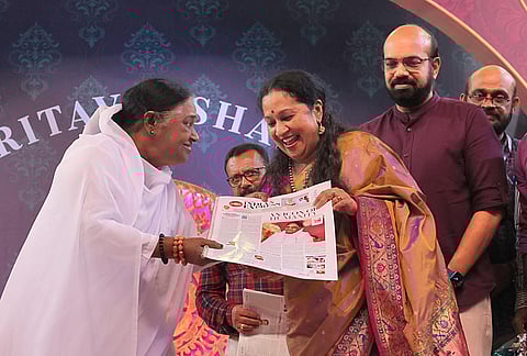 TNIE's chief executive officer Lakshmi Menon presented the eight-page supplement to Amritanandamayi at the ashram in Kollam (Photo | Express)