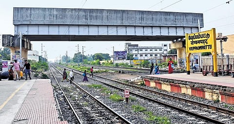 Passengers cross railway tracks to go from one platform to the other in the absence of a rail overbridge at Veppampattu station | D Sampathkumar