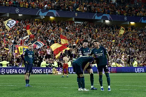 Arsenal's players react after losing the UEFA Champions League Group B football match between RC Lens and Arsenal FC. (Photo | AFP)