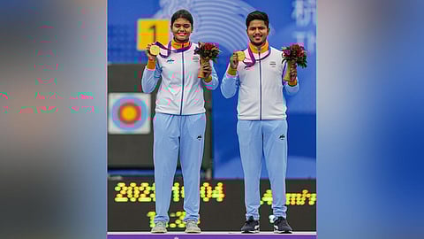 Gold medal winner India's Ojas Pravin Deotale and Jyothi Surekha Vennam on the podium during the medal ceremony of mixed team compound archery event at the 19th Asian Games. (Photo | PTI)