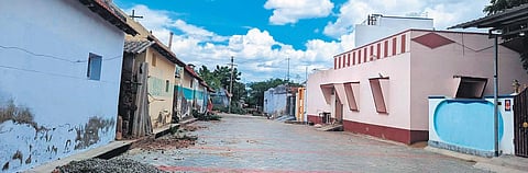 Dalit houses (L) with entrance facing away from upper caste homes at Perumalpatti