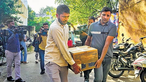 Material confiscated after the raid on the office of NewsClick being brought to Special Cell office on Tuesday |