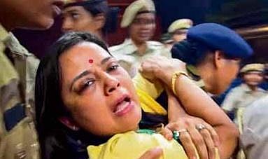 TMC MP Mahua Moitra being detained during a protest in New Delhi on Tuesday | PTI
