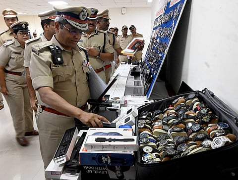 Police Commissioner B Dayanada inspects ornaments and electronic items recovered by Tilak Nagar and Sanjay Nagar police, on Tuesday. (Photo | Shashidhar Byrappa)