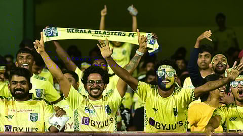Kerala Blasters fans celebrating at JLN Stadium.