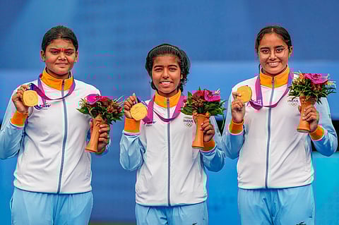 Gold medal winning India's Jyothi Surekha Vennam, Aditi Gopichand and Parneet Kaur. (Photo | PTI)