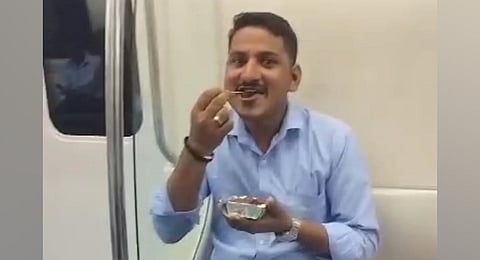 A viral video of Sunil Kumar eating in a Metro train in Bengaluru. (Photo | Instagram) 