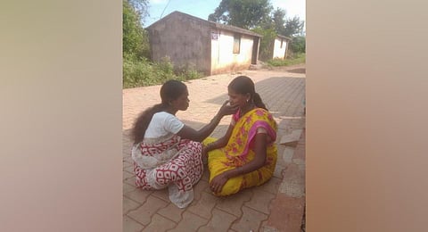 M Parvathi, an ASHA worker checking a pregnant woman.(Photo | Express)