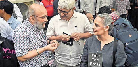 Journalist Paranjoy Guha Thakurta and author Arundhati Roy at a protest held at Press Club of India on Wednesday. (Photo | Shekhar Yadav)