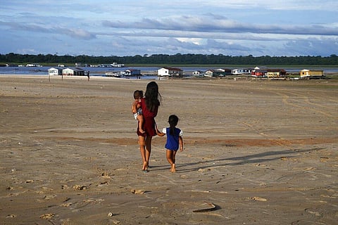 Representational Image: Children walk in an area impacted by the drought near the Solimoes River, in Tefe, Amazonas state, Brazil, October 19, 2022. (File Photo | AP)