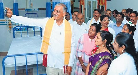 Health Minister T Harish Rao clicks a selfie with staffers at the government medical college in Siddipet on Thursday after inaugurating a 1,000-bed hospital.