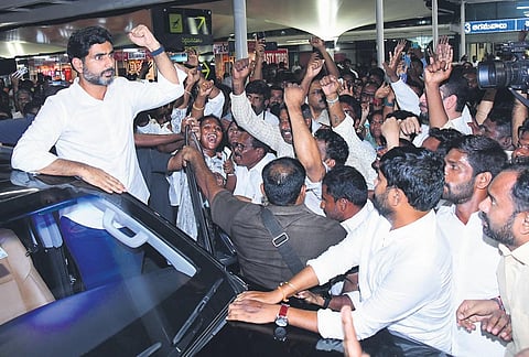 TDP general secretary Lokesh greets party activists on his arrival at Vijayawada International Airport from New Delhi on Thursday I Express