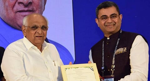 FICCI president Subhrakant Panda with Gujarat Chief Minister Bhupendra Patel. (Photo | Express)