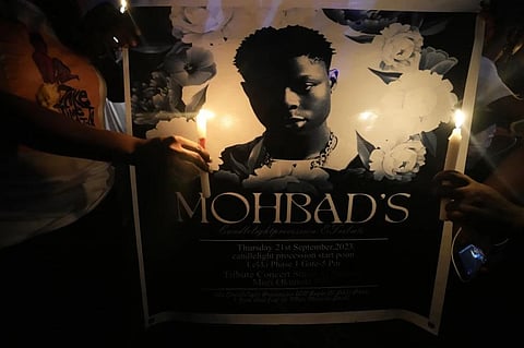 People hold candles during a minute of silence during a protest at a park in Lagos, Nigeria, Thursday, Sept. 21, 2023, to demand justice for Afrobeat star Mohbad following his death. (Photo | AP)