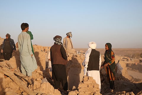 Afghan residents clear debris from a damaged house after earthquake in Sarbuland village of Zendeh Jan district of Herat province on October 7,2023. (Photo | AFP)