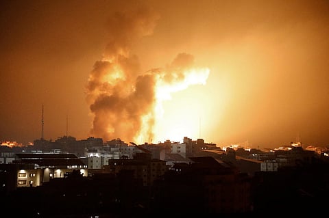 Fire and smoke rises above buildings during an Israeli air strike in Gaza City on October 8, 2023. (Photo | AFP)