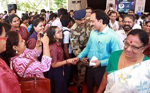 ISRO chairman S Somnath interacts with school students at Vikram Sarabhai Science School, Kakkanad on Saturday. Indira Rajan, chairperson of VSSF, looks on.| Express Photo by TP Sooraj ( Story Photo )