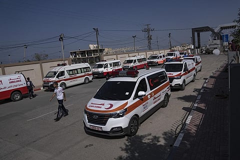 Ambulances with Palestinians wounded in the Israeli bombardment of the Gaza Strip arrive at Rafah border crossing to Egypt Wednesday. (Photo | AP)