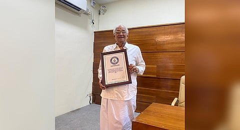 P B Menon with the certificate issued by the Guinness World Records