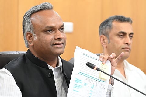 RDPR minister Priyank Kharge addresses a press conference at Vidhana Soudha. 