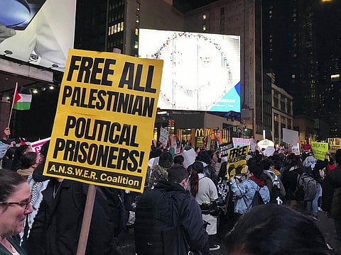 Pro-Palestinian demonstrators protest outside of The New York Times, Thursday, Nov. 9, 2023 in New York. (AP)