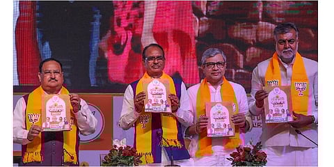 BJP National President JP Nadda with Madhya Pradesh Chief Minister Shivraj Singh Chouban and others releases election manifesto. (Photo | PTI)