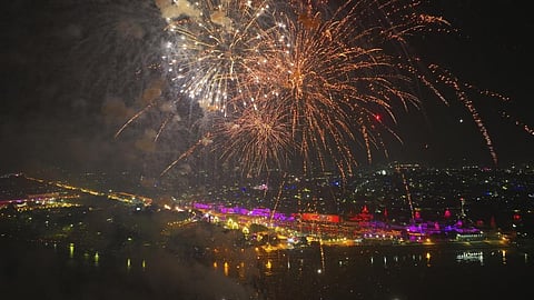 Fireworks light the sky as lamps are light up the banks of the river Saryu on the eve of Diwali, in Ayodhya, Saturday, Nov. 11, 2023. (Photo | AP)
