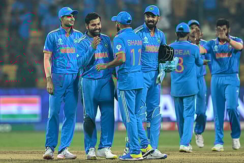 India's players celebrate their win at the end of the 2023 ICC Men's Cricket World Cup one-day international (ODI) match against Netherlands at the M. Chinnaswamy Stadium in Bengaluru. (Photo | AFP)